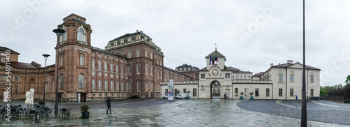 Extra wide angle view of The beautiful facades of the Royal Palace of the Savoy in the Venaria Reale
