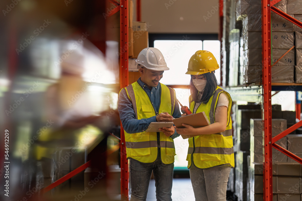 Working at warehouse. Male warehouse worker checking in storage department. Employee organizing goods distribution to the market. Working at warehouse. Male warehouse worker checking in storage department. Employee organizing goods distribution to the market.