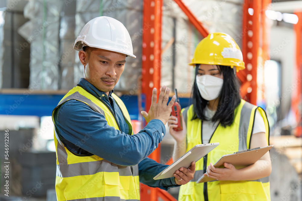 Working at warehouse. Male warehouse worker checking in storage department. Employee organizing goods distribution to the market. Working at warehouse. Male warehouse worker checking in storage department. Employee organizing goods distribution to the market.