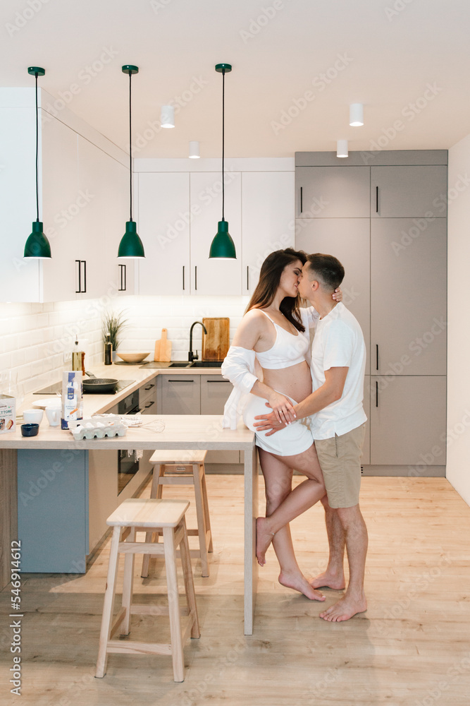 Pregnancy photo session at home, in the kitchen, in the room on the bed, by the window and in the bathroom, brushing your teeth, putting your hands on your tummy and making cheesecakes from flour Pregnancy photo session at home, in the kitchen, in the room on the bed, by the window and in the bathroom, brushing your teeth, putting your hands on your tummy and making cheesecakes from flour