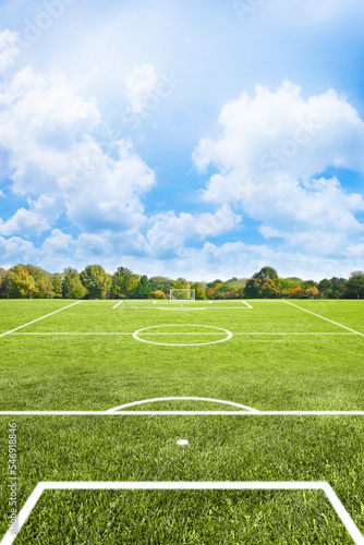 Murais de parede White lines of a soccer field against soft green grass
