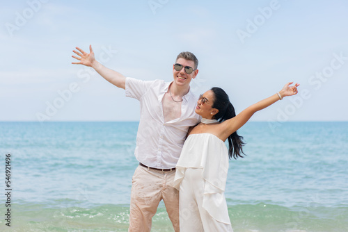 Romantic lovers young couple relaxing together on the tropical beach.Couple lover enjoy life.Summer vacations