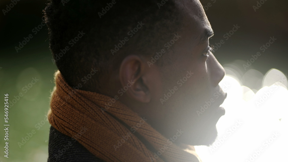 Contemplative young black man closing eyes in meditation Contemplative young black man closing eyes in meditation