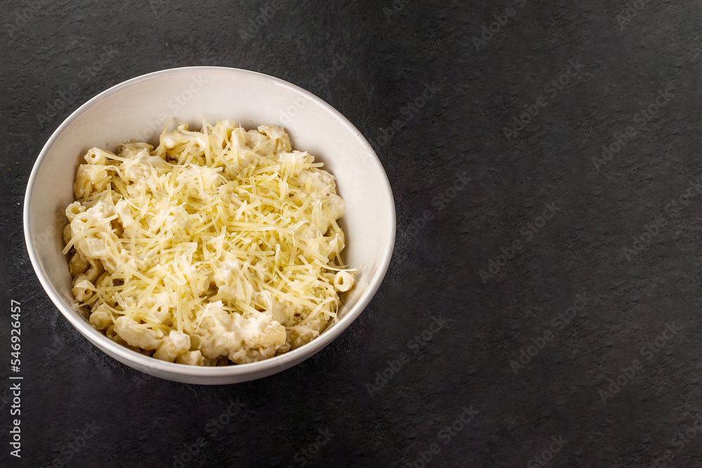 Mac and cheese. Traditional american fast food. Pasta with sauce from chedder parmesan mozarella and other cheese. Mac and cheese. Traditional american fast food. Pasta with sauce from chedder parmesan mozarella and other cheese.
