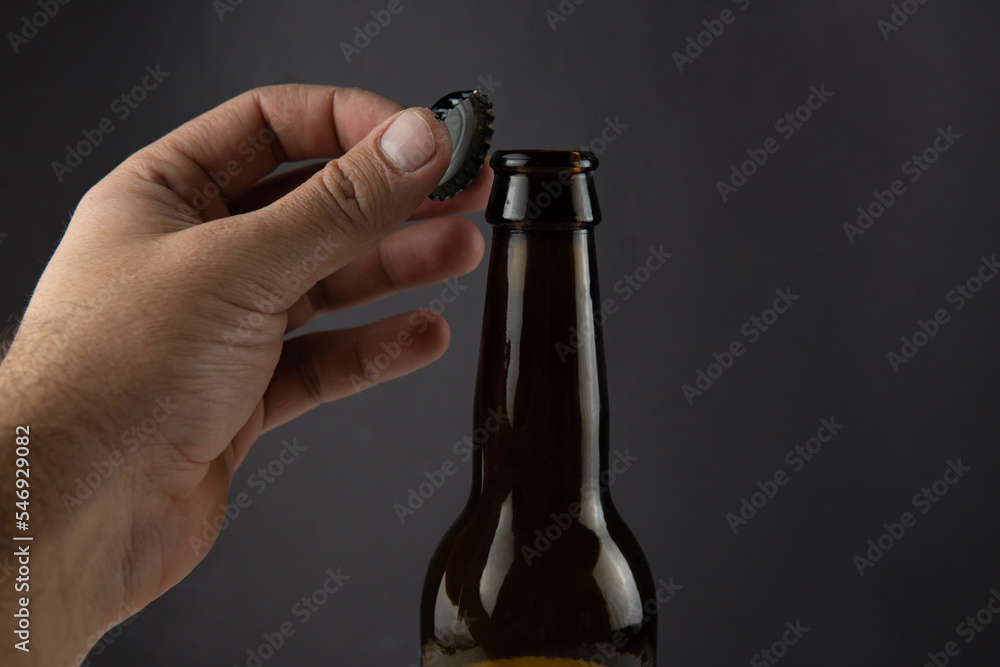 A bottle of beer in a black bottle A bottle of beer in a black bottle