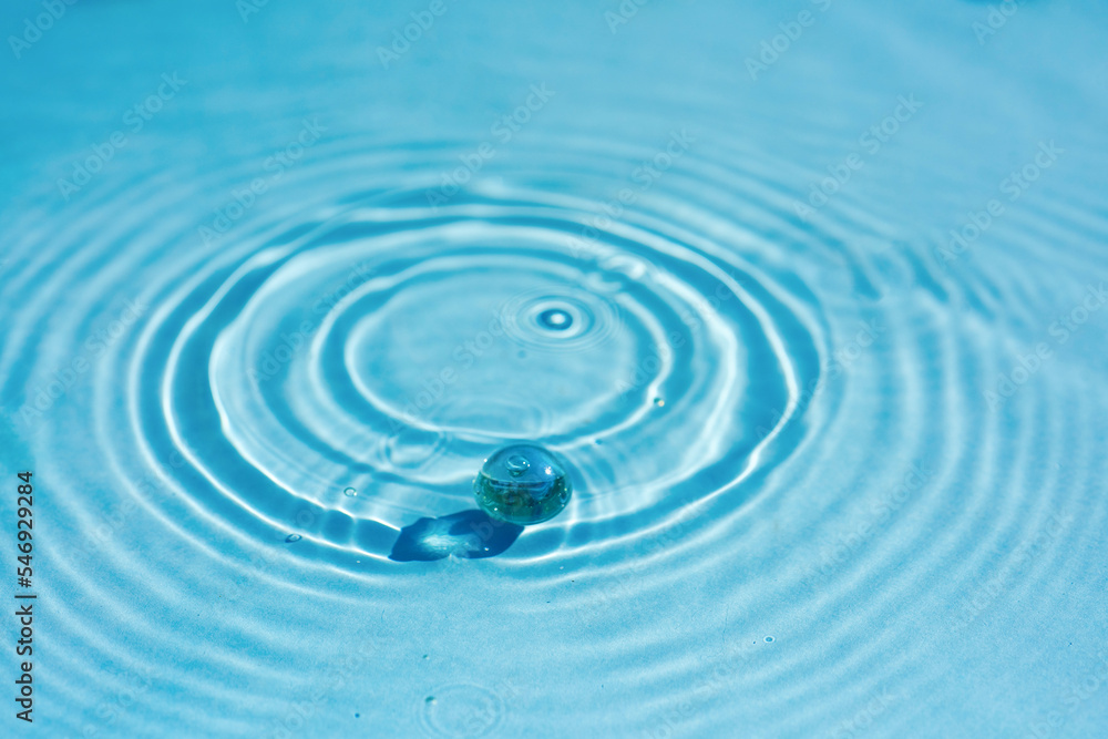 Clear water surface texture in transparent blue color with ripples, splashes and granules. Clear water surface texture in transparent blue color with ripples, splashes and granules.