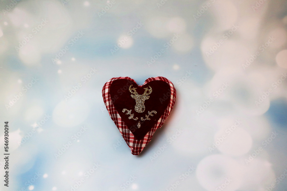heart with reindeer horns isolated on snow background christmas