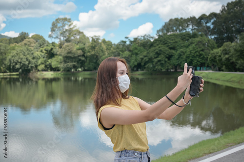 Young woman using smart phone for take a photo