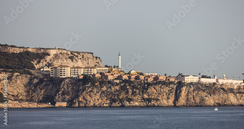 City Buildings, Homes and Mountain by the Sea. Sunny Sky. Gibraltar, United Kingdom.