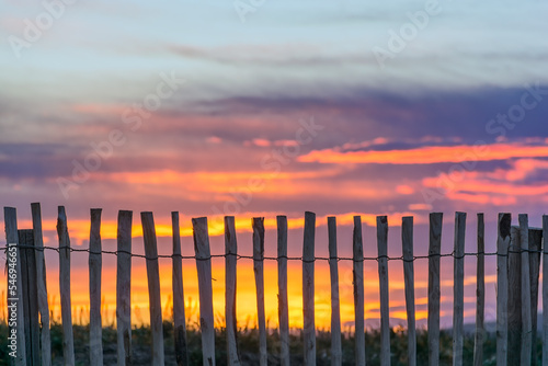 Scenic view of wooden fence at beach against dramatic sunset sky at Saint Tropez south of France