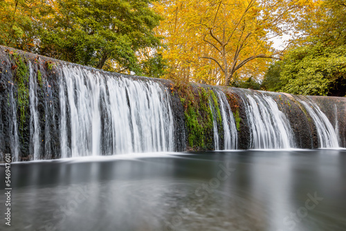 Scenic view of waterfall in forest in south of France during autumn