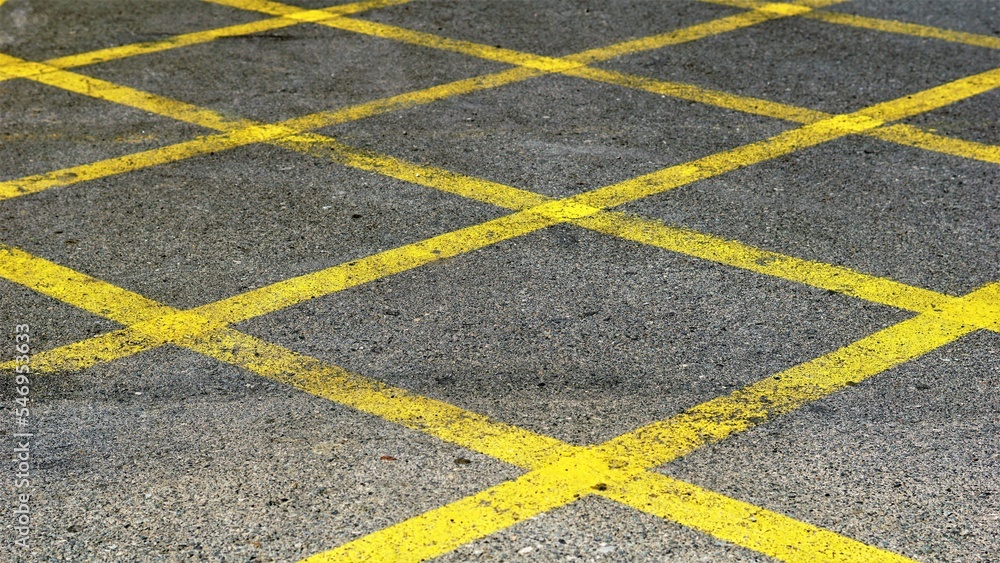 yellow stripes on the asphalt background
