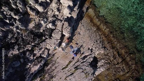 Drone view of  people resting at the Zarace beach, Hvar Island, Croatia, aerial photo