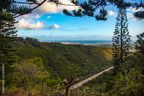 view from the aiea loop trail of the oahu skyline and the famous highway; hiking in the hawaiian islands near honolulu photo