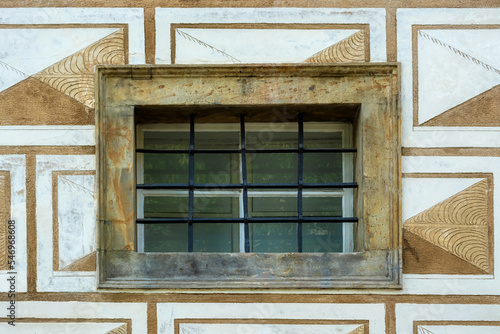 Small rectangular window with metal bars. From the Window of the World series.