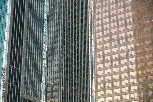 Wallpaper Mural Close detail on bronze and green-hued office windows in skyscrapers, creating abstract background pattern Torontodigital.ca