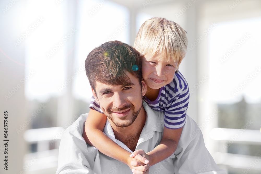 Fototapeta premium Happy young father with child, playing together
