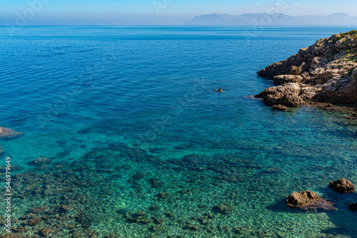 The Disa cove in the nature reserve of the Zingaro National Park in Sicily. The small bay with the pebble beach, offers the possibility to swim in the crystal-clear water of the Mediterranean Sea