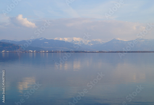 tranquil wintery lake Constance (Bodensee) with the snowy Alps in the background (Lindau in Germany) 