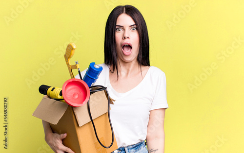 Canvas Print looking very shocked or surprised. housekeeper with a toolbox