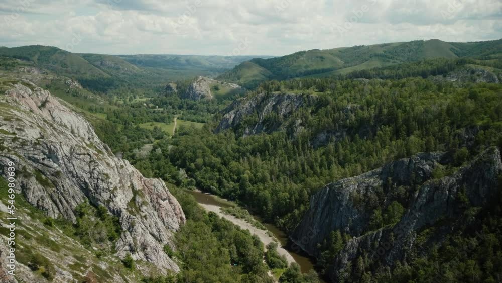 valley between mountain ranges, coniferous forest, video from a copter valley between mountain ranges, coniferous forest, video from a copter