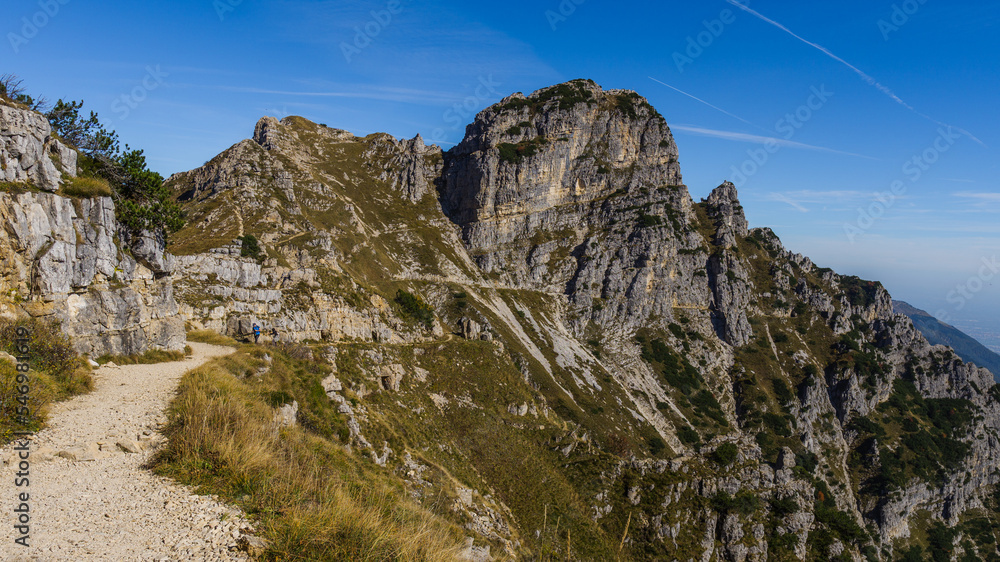 Mountain trail road in Mount Pasubio in the Italian Alps during fall season