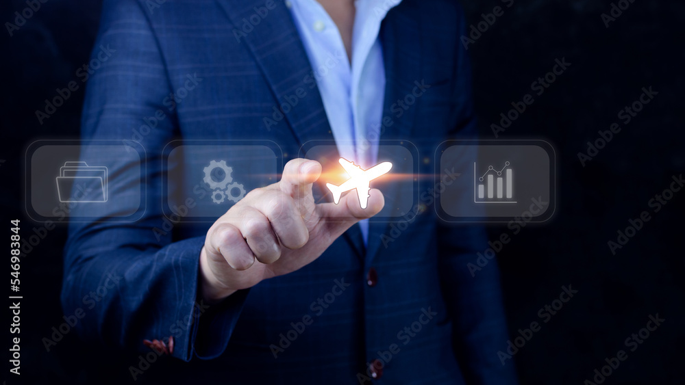 Businessman pointing finger touching to select flight by pressing touch screen airplane button,Business Airplane transportation concept Businessman pointing finger touching to select flight by pressing touch screen airplane button,Business Airplane transportation concept