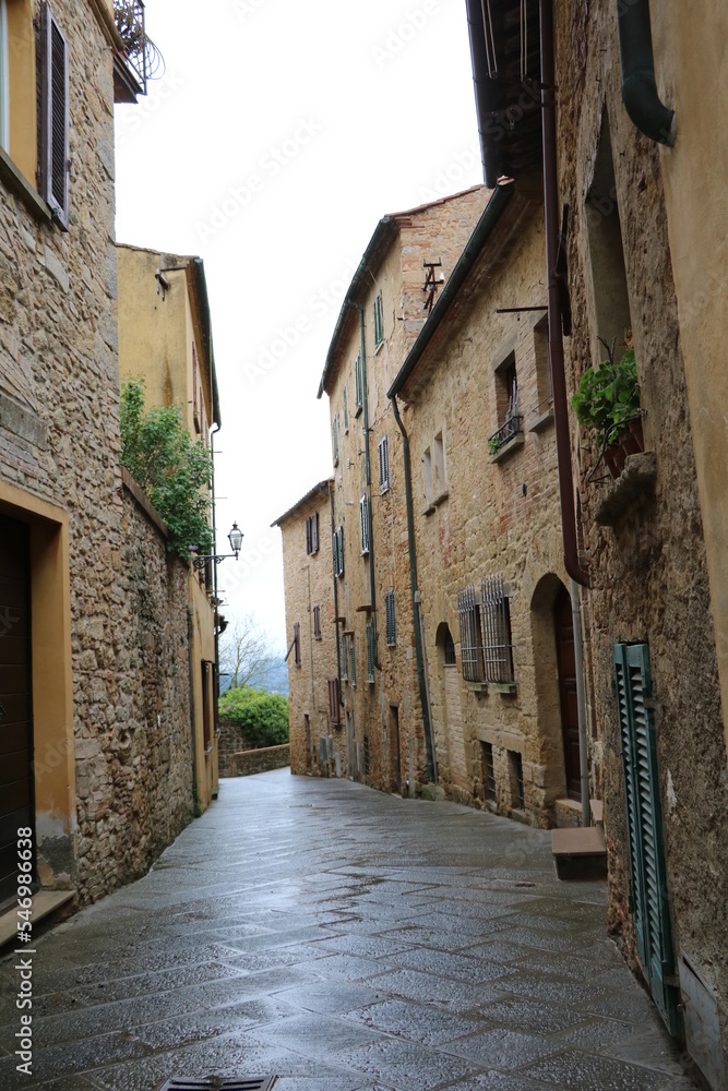 Old narrow alley in Volterra at Regen, Tuscany Italy