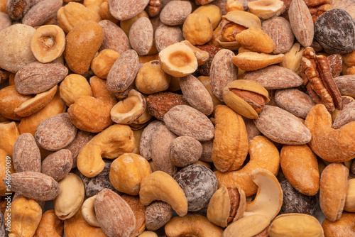 A group of almonds, pistachios, walnuts, macadamia, cashews.