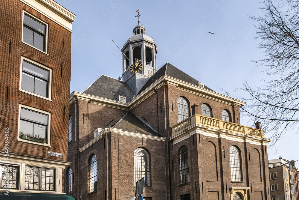 Fototapeta premium Oosterkerk (Eastern church) - 17th-Century Dutch Reformed church on Wittenburgergracht (Wittenburger) canal on Wittenburg in Amsterdam, The Netherlands.