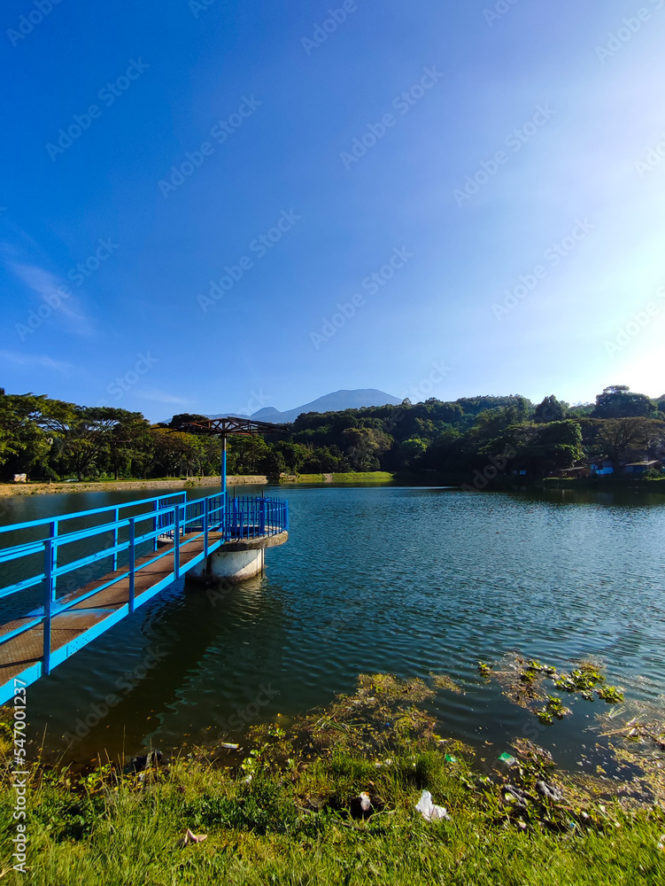 Beautiful landscape view of lake and mountain with clear blue sky in the morning