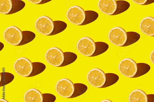 Lemon pattern on a yellow background. Pop art design, creative citruses. Yellow lemon, minimal flat style.