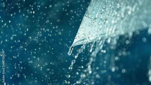 Rain drops on transparent umbrella, super slow motion filmed on high soeed cinematic camera at 1000 fps photo