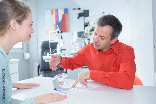 patient and doctor with medical material photo