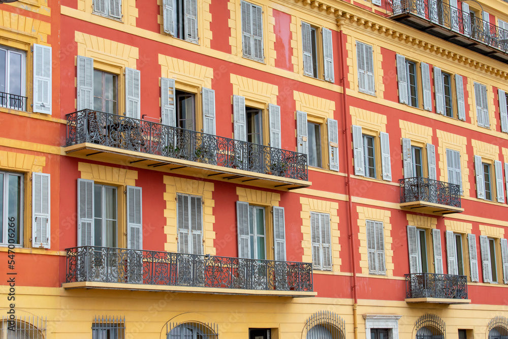 Colourful Exterior of Building with windows and balcony in Monaco Colourful Exterior of Building with windows and balcony in Monaco