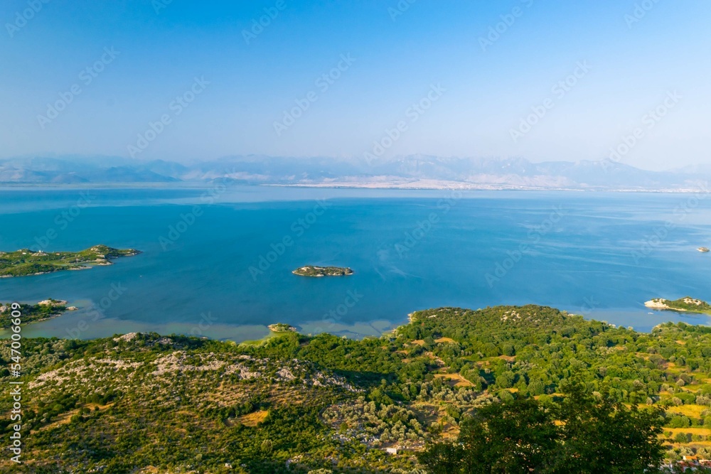 Shtegvashe Viewpoint. Beautiful summer landscape of small green islands and blue waters of Lake Skadar near the border with Albania. Montenegro.