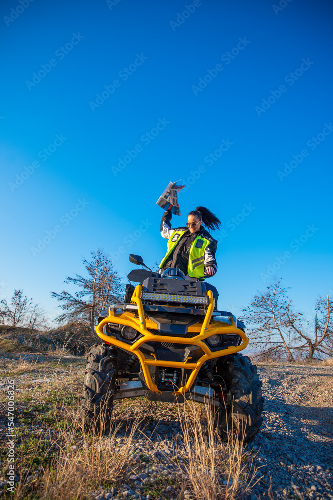 Obraz premium Girl riding a quad bike
