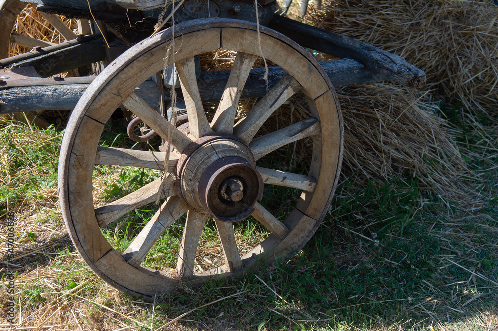 An old wooden cart for transporting hay and straw, with an iron-hooped wooden one. Used on farms in the countryside