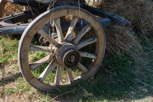 An old wooden cart for transporting hay and straw, with an iron-hooped wooden one. Used on farms in the countryside