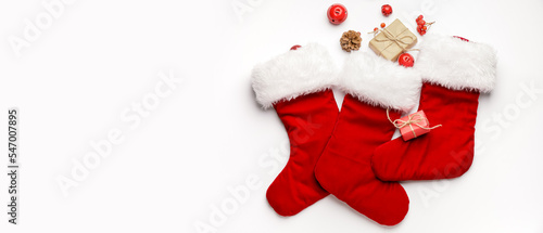Composition with Christmas socks on white background with space for text