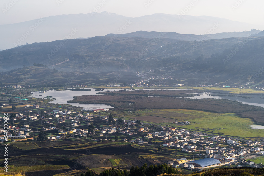 Fototapeta premium Beautiful lagoon near mountains and a city, Colta Lake