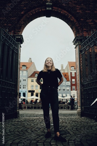 Photography Vertical shot of a Caucasian (White) female standing with smile