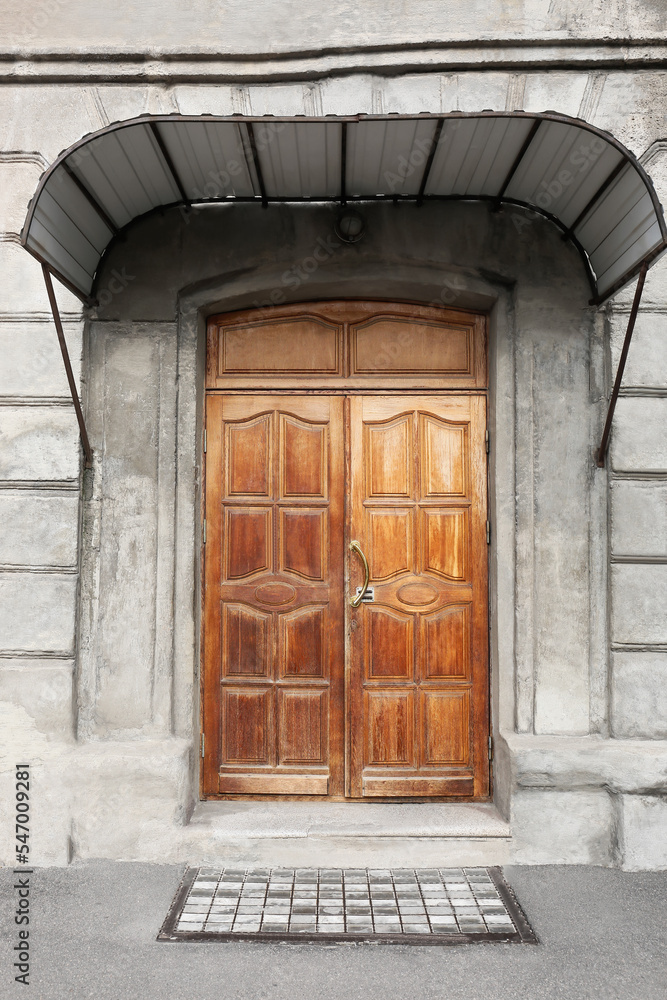 Building with wooden doors and visor Building with wooden doors and visor
