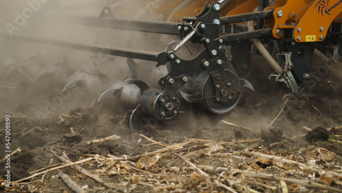 Tractor working in the field. Autumn tillage. Deep ripping with powerful tractor