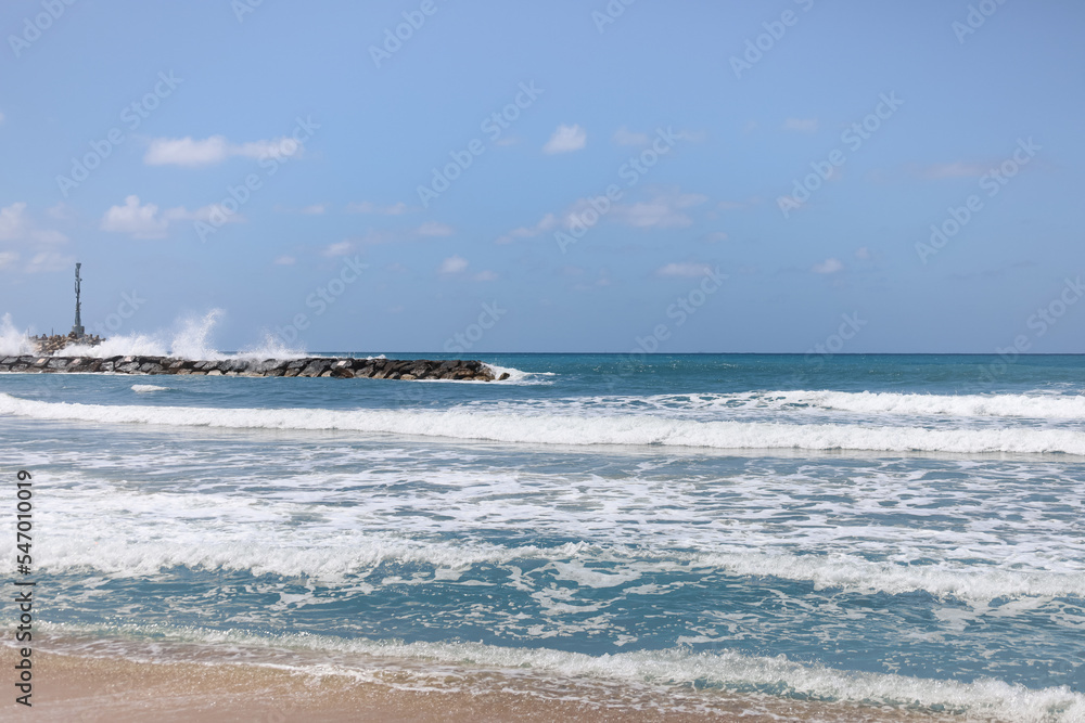 View of beautiful sea with waves and rocks