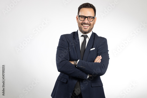 Business man formaly dressed, picture taken on white background. Studio portrait photo