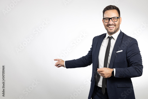 Studio portrait of young, happy business man. White background studio portrait. Isolated background