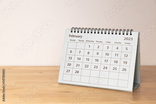 February in 2023 paper calendar on the wooden table - month page