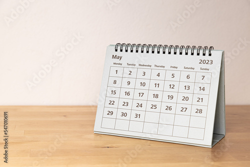 May in 2023 paper calendar on the wooden table - month page