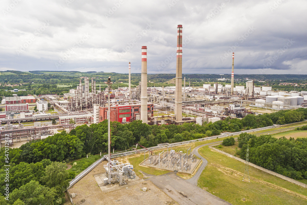 Obraz premium Aerial view of oil refinery in Kralupy nad Vltavou. Large industrial process plant producing gasoline (petrol), diesel fuel and other petroleum products. Kralupy nad Vltavou, Czech republic, Europe.